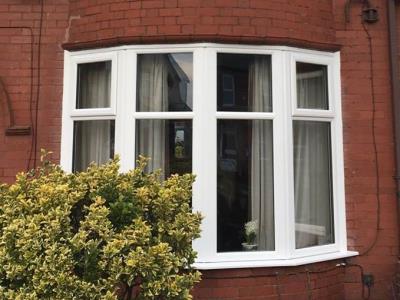 Rotten wooden bay windows replaced with white A rated uPVC reinforced windows for a 1930s home in Bispham, Blackpool.