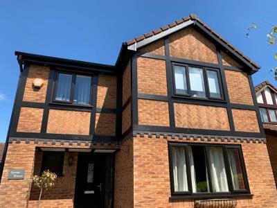 Black UPVC high effiency double glazed windows and black composite door installed to a Kirkham home.