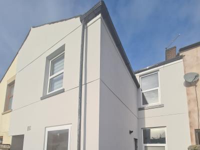 Re-rendering of a Blackpool property to a smooth finish with a light grey exterior wall coating.